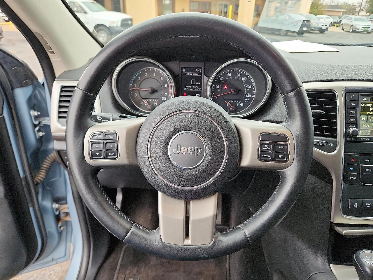 2013 BLUE Jeep Grand Cherokee Laredo (1C4RJFAT7DC) with an HEMI 5.7L V-8 variable valve control, regular unleaded, engine with cylinder deactivation and 360HP engine, located at 4711 Ave Q, Lubbock, TX, 79412, (806) 687-2362, 33.551304, -101.855293 - Photo#24