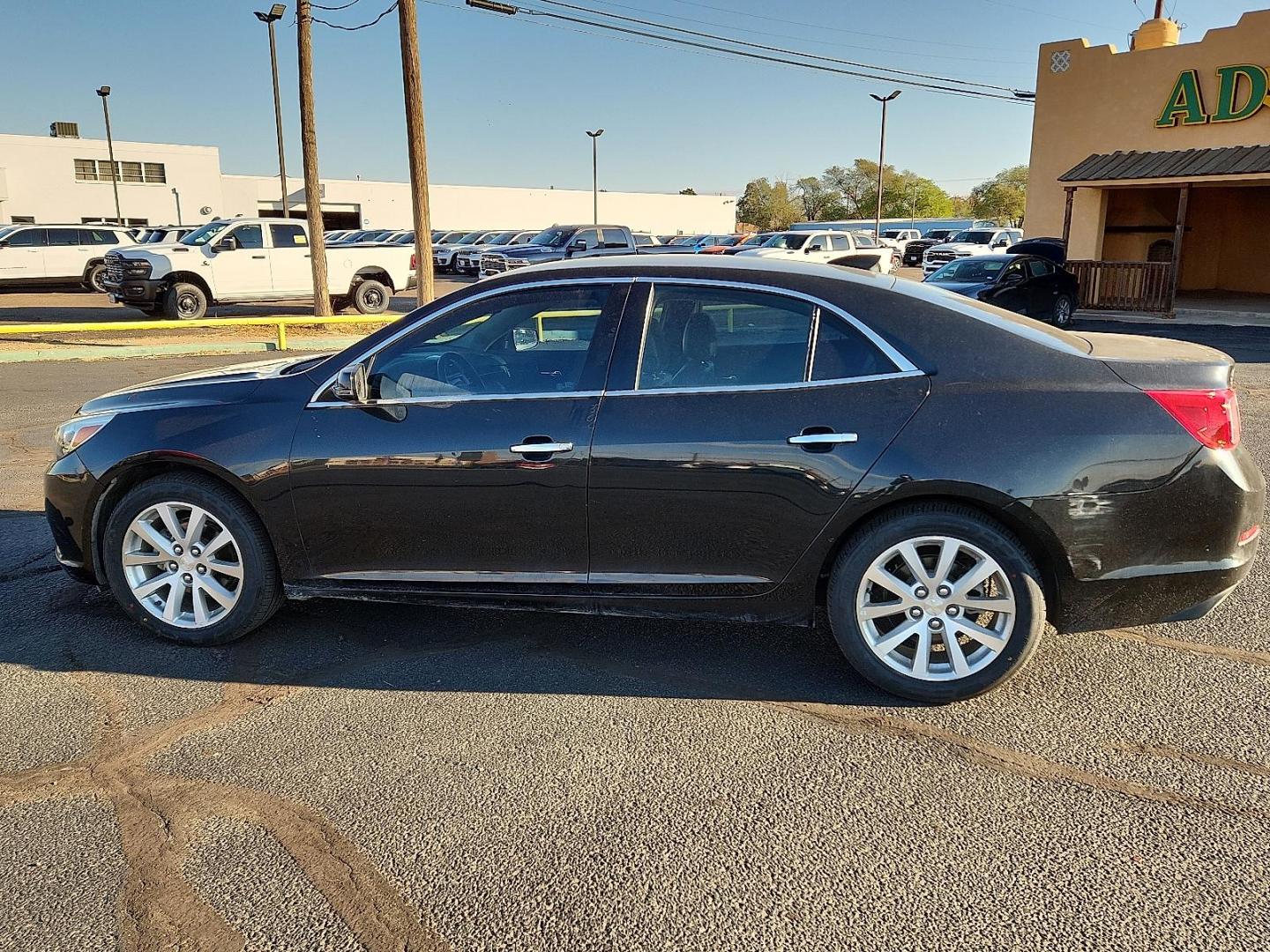 2015 BLACK Chevrolet Malibu 1LZ (1G11F5SLXFF) with an ECOTEC 2.5L I-4 gasoline direct injection, DOHC, variable valve control, regular unleaded, engine with 196HP engine, located at 4711 Ave Q, Lubbock, TX, 79412, (806) 687-2362, 33.551304, -101.855293 - Photo#1