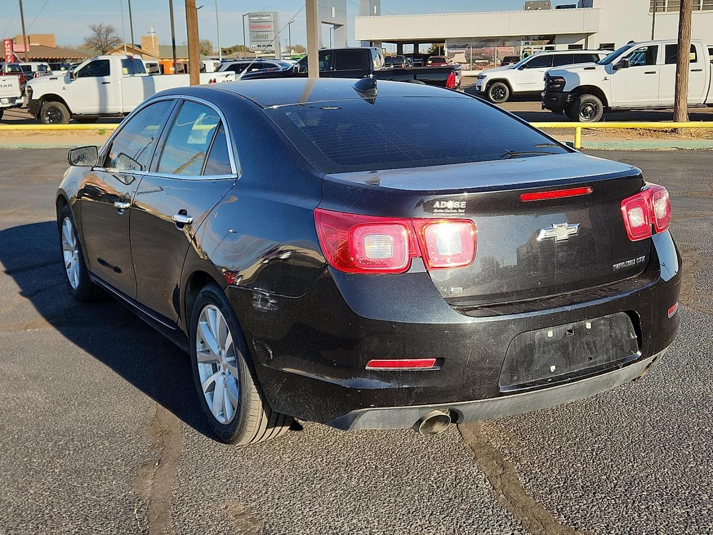 2015 BLACK Chevrolet Malibu 1LZ (1G11F5SLXFF) with an ECOTEC 2.5L I-4 gasoline direct injection, DOHC, variable valve control, regular unleaded, engine with 196HP engine, located at 4711 Ave Q, Lubbock, TX, 79412, (806) 687-2362, 33.551304, -101.855293 - Photo#2