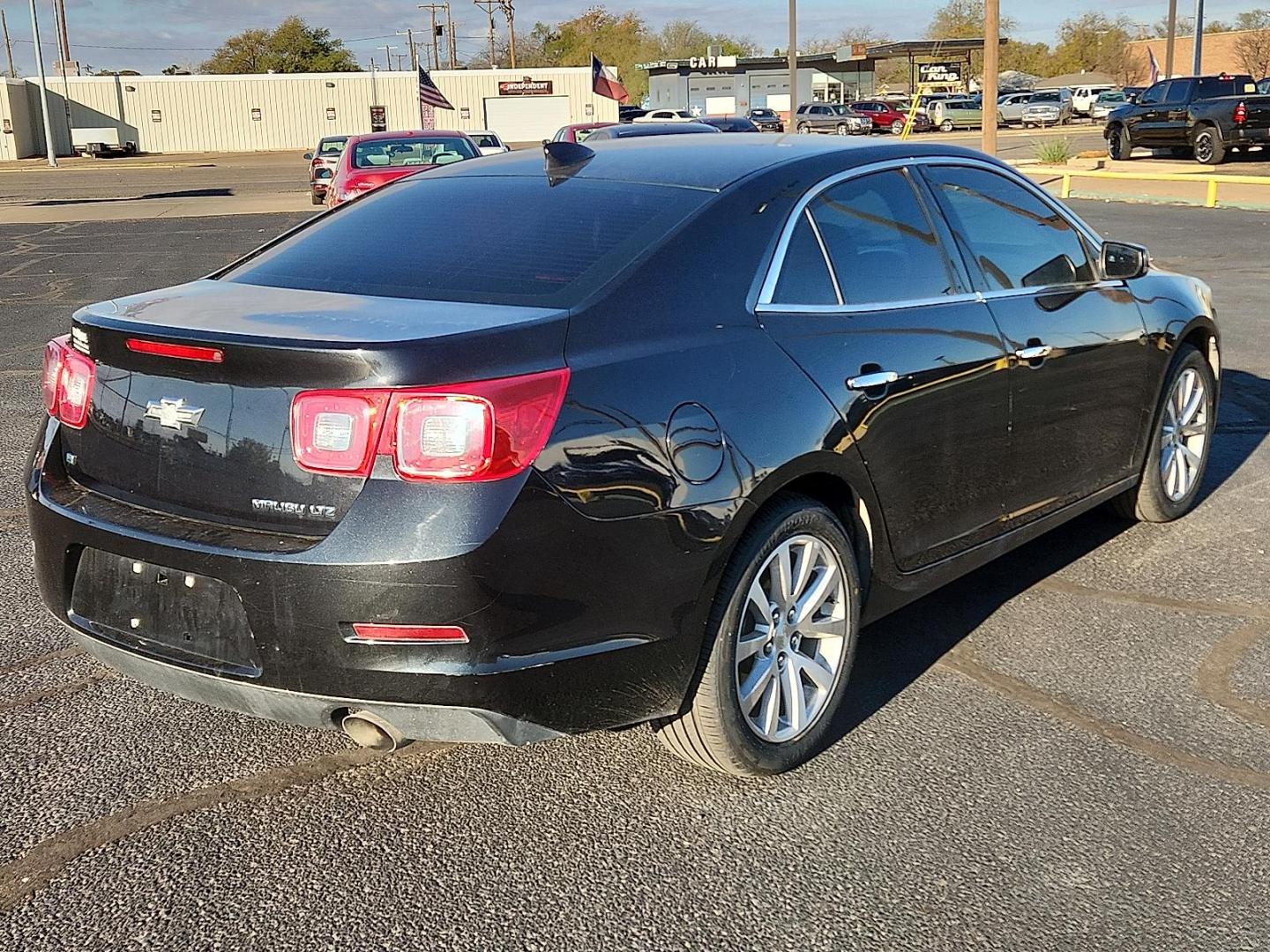 2015 BLACK Chevrolet Malibu 1LZ (1G11F5SLXFF) with an ECOTEC 2.5L I-4 gasoline direct injection, DOHC, variable valve control, regular unleaded, engine with 196HP engine, located at 4711 Ave Q, Lubbock, TX, 79412, (806) 687-2362, 33.551304, -101.855293 - Photo#3