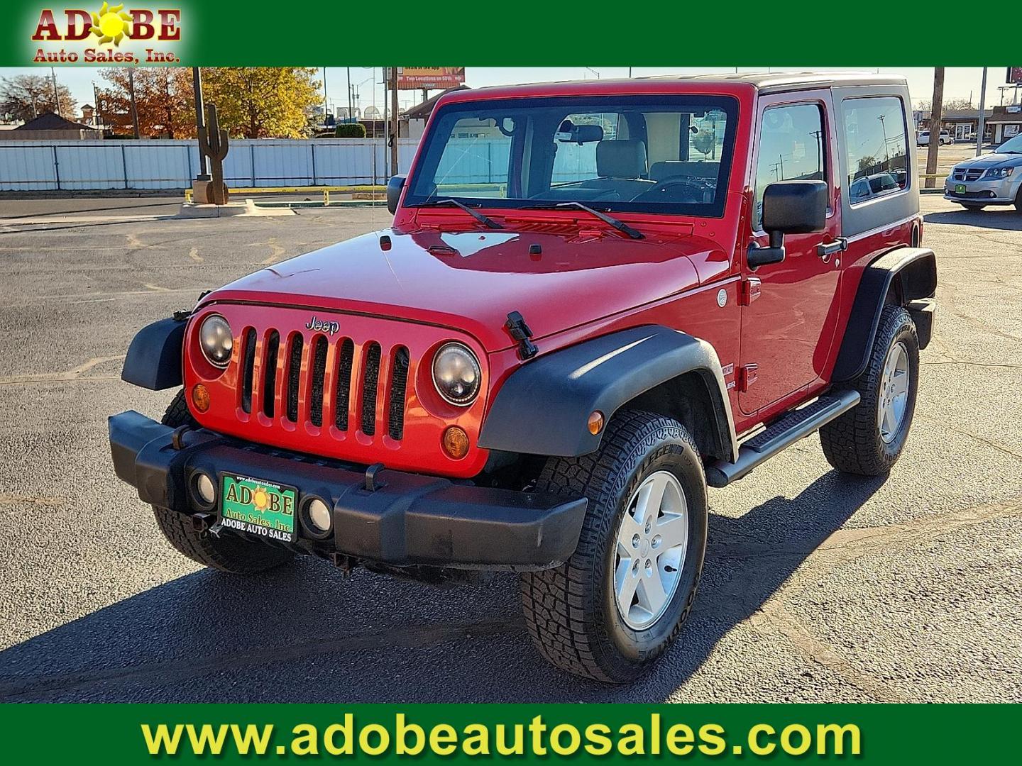2010 RED Jeep Wrangler Sport (1J4AA2D18AL) with an 3.8L V-6 regular unleaded, engine with 202HP engine, located at 4711 Ave Q, Lubbock, TX, 79412, (806) 687-2362, 33.551304, -101.855293 - Photo#0