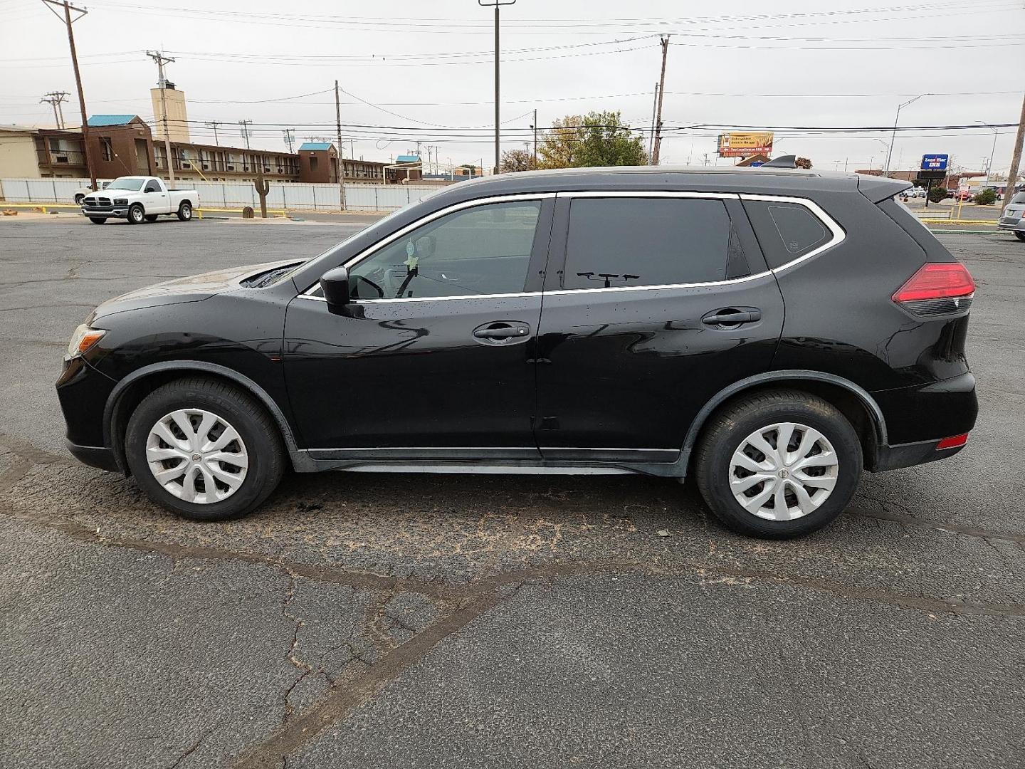 2017 BLACK Nissan Rogue S (JN8AT2MT3HW) with an 2.5L I-4 DOHC, variable valve control, regular unleaded, engine with 170HP engine, located at 4711 Ave Q, Lubbock, TX, 79412, (806) 687-2362, 33.551304, -101.855293 - Photo#1