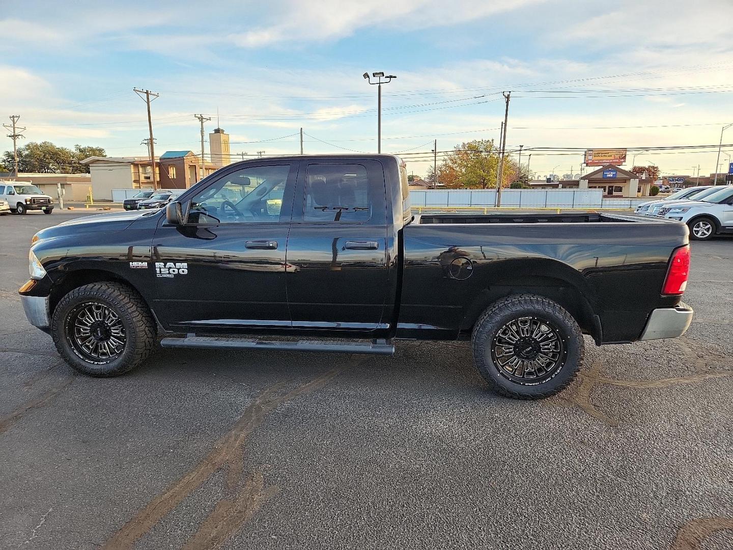 2019 BLACK Ram 1500 Classic Tradesman Quad Cab 4x2 6'4" Box (1C6RR6FT9KS) with an HEMI 5.7L V-8 variable valve control, regular unleaded, engine with cylinder deactivation and 395HP engine, located at 4711 Ave Q, Lubbock, TX, 79412, (806) 687-2362, 33.551304, -101.855293 - Photo#1