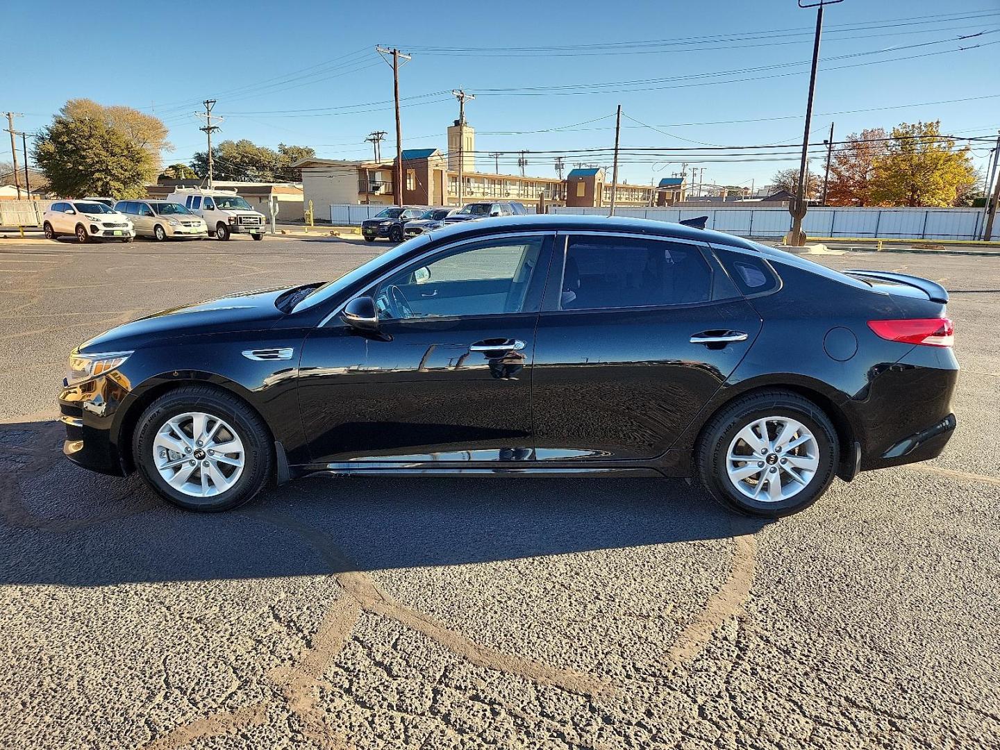 2016 BLACK Kia Optima LX (5XXGT4L35GG) with an Theta II 2.4L I-4 gasoline direct injection, DOHC, CVVT variable valve control, regular unleaded, engine with 185HP engine, located at 4711 Ave Q, Lubbock, TX, 79412, (806) 687-2362, 33.551304, -101.855293 - Photo#1