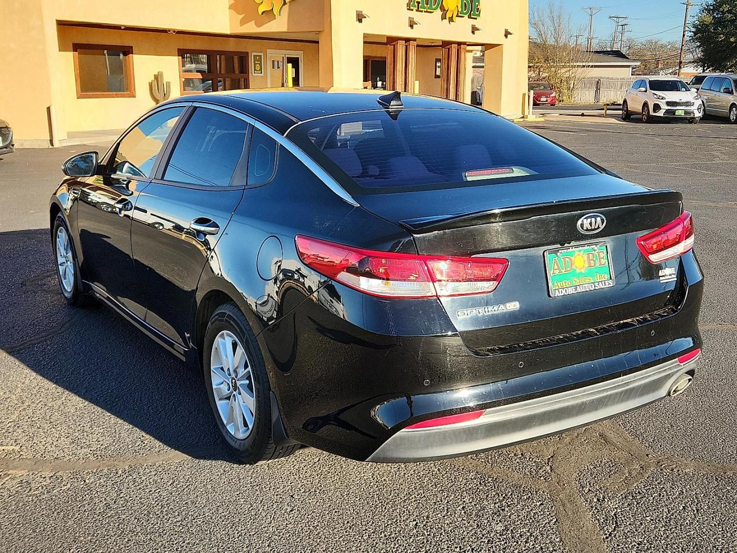 2016 BLACK Kia Optima LX (5XXGT4L35GG) with an Theta II 2.4L I-4 gasoline direct injection, DOHC, CVVT variable valve control, regular unleaded, engine with 185HP engine, located at 4711 Ave Q, Lubbock, TX, 79412, (806) 687-2362, 33.551304, -101.855293 - Photo#2