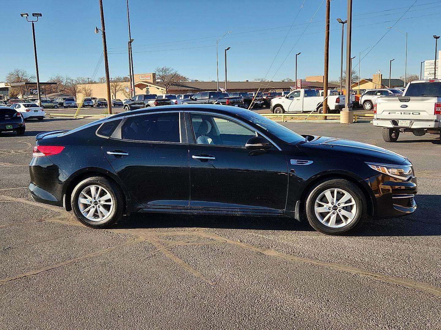 2016 BLACK Kia Optima LX (5XXGT4L35GG) with an Theta II 2.4L I-4 gasoline direct injection, DOHC, CVVT variable valve control, regular unleaded, engine with 185HP engine, located at 4711 Ave Q, Lubbock, TX, 79412, (806) 687-2362, 33.551304, -101.855293 - Photo#4