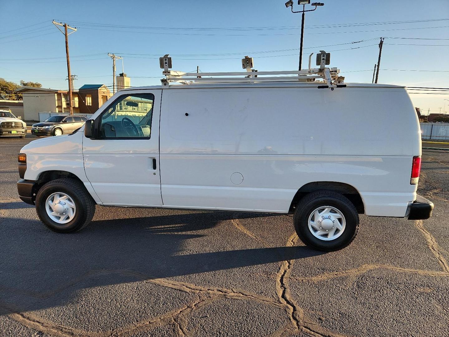 2011 WHITE Ford E-250 Commercial (1FTNE2EL3BD) with an Triton 5.4L V-8 engine with 255HP engine, located at 4711 Ave Q, Lubbock, TX, 79412, (806) 687-2362, 33.551304, -101.855293 - Photo#1
