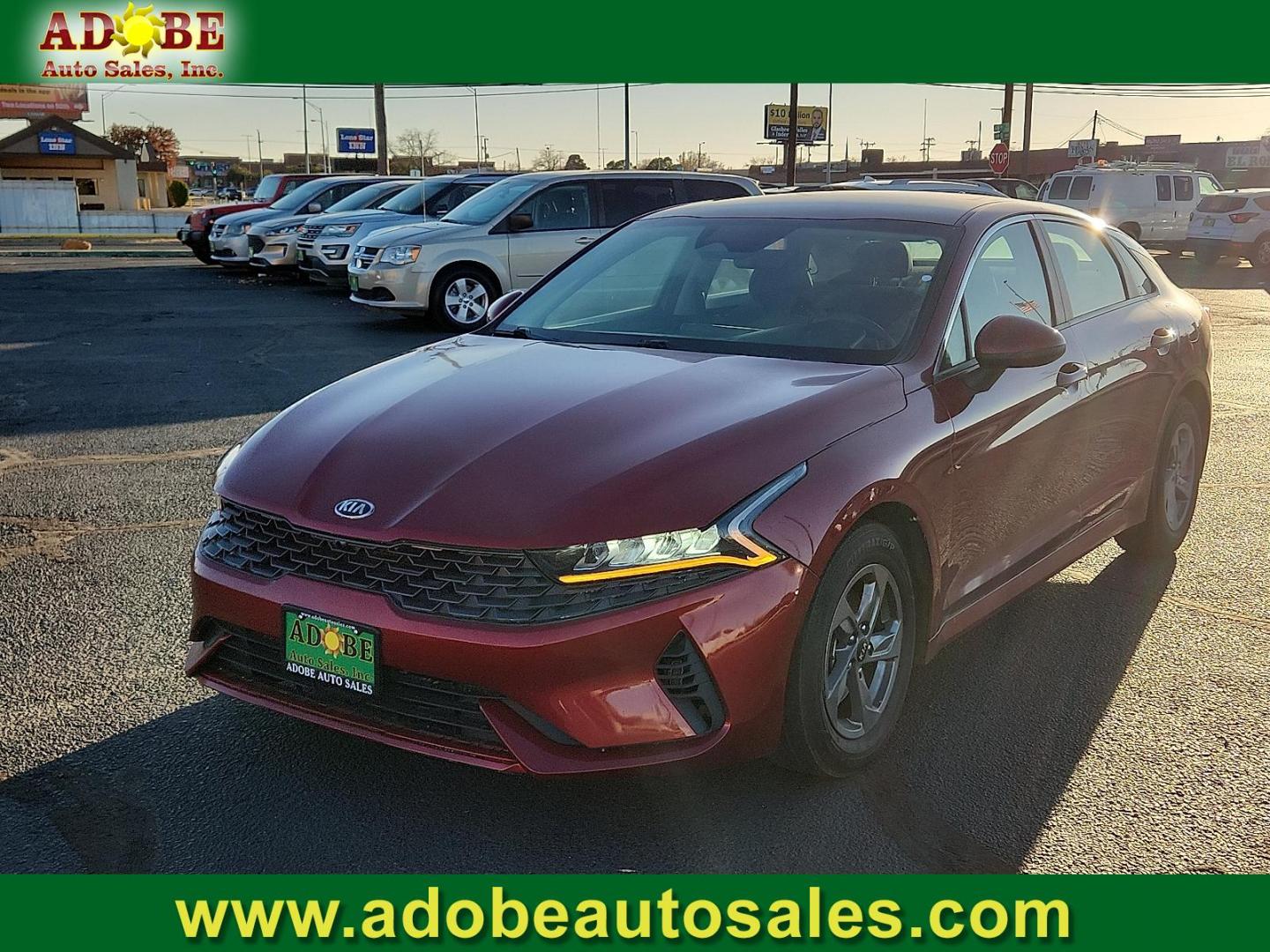 2021 RED Kia K5 LXS (5XXG14J28MG) with an Gamma-II 1.6L I-4 gasoline direct injection, DOHC, CVVD variable valve control, intercooled turbo, regular unleaded, engine with 180HP engine, located at 4711 Ave Q, Lubbock, TX, 79412, (806) 687-2362, 33.551304, -101.855293 - Photo#0