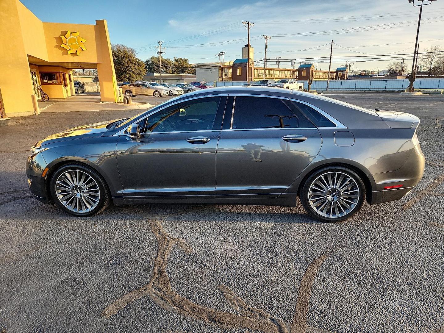 2016 GRAY Lincoln MKZ (3LN6L2G95GR) with an EcoBoost 2L I-4 gasoline direct injection, DOHC, variable valve control, intercooled turbo, premium unleaded, engine with 240HP engine, located at 4711 Ave Q, Lubbock, TX, 79412, (806) 687-2362, 33.551304, -101.855293 - Photo#1