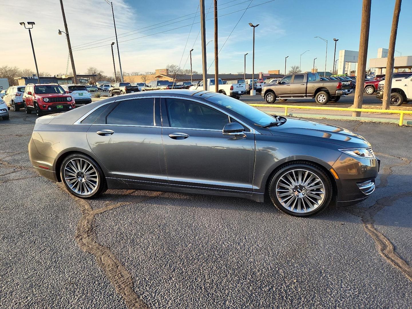 2016 GRAY Lincoln MKZ (3LN6L2G95GR) with an EcoBoost 2L I-4 gasoline direct injection, DOHC, variable valve control, intercooled turbo, premium unleaded, engine with 240HP engine, located at 4711 Ave Q, Lubbock, TX, 79412, (806) 687-2362, 33.551304, -101.855293 - Photo#4