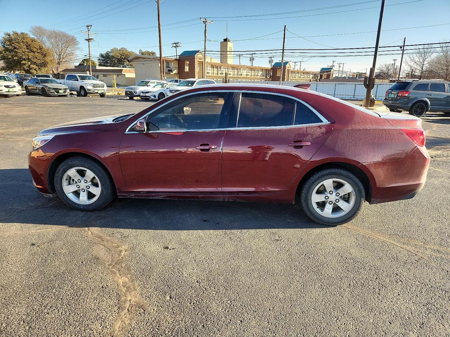 2016 RED Chevrolet Malibu Limited LT (1G11C5SA5GF) with an 2.5L I-4 gasoline direct injection, DOHC, variable valve control, regular unleaded, engine with 202HP engine, located at 4711 Ave Q, Lubbock, TX, 79412, (806) 687-2362, 33.551304, -101.855293 - Photo#1