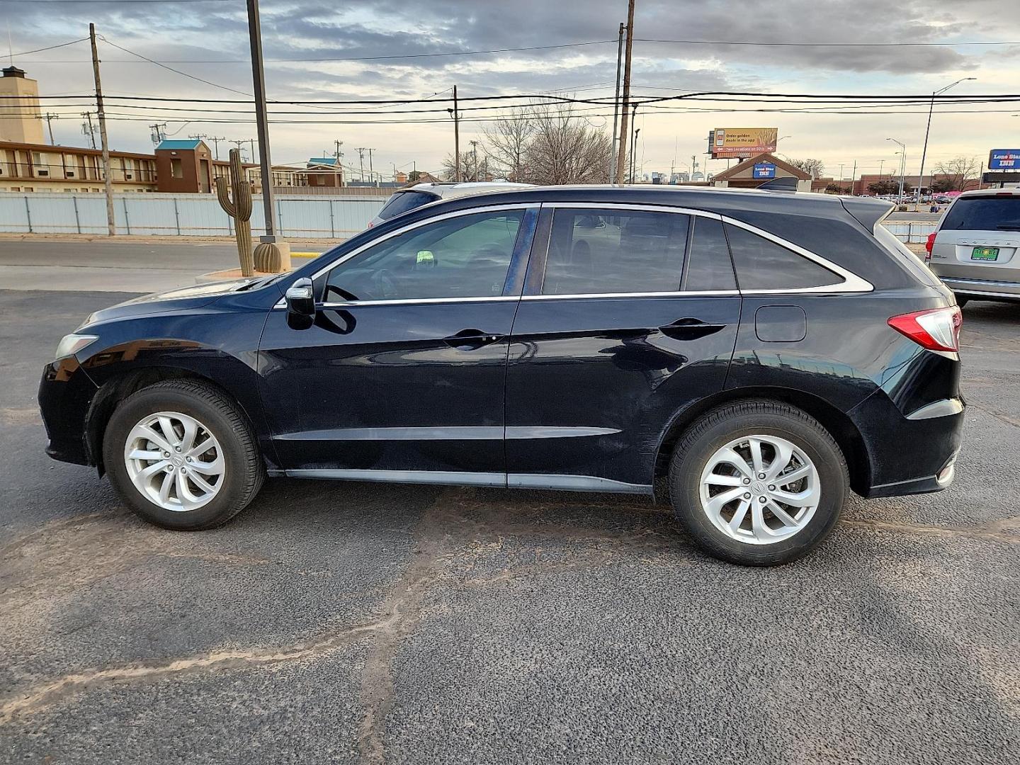 2017 BLACK Acura RDX w/AcuraWatch Plus Package (5J8TB3H33HL) with an 3.5L V-6 i-VTEC variable valve control, premium unleaded, engine with cylinder deactivation and 279HP engine, located at 4711 Ave Q, Lubbock, TX, 79412, (806) 687-2362, 33.551304, -101.855293 - Photo#1