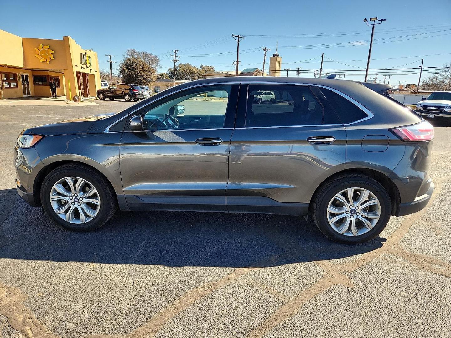 2019 GRAY Ford Edge Titanium (2FMPK3K91KB) with an EcoBoost 2L I-4 gasoline direct injection, DOHC, variable valve control, intercooled turbo, premium unleaded, engine with 250HP engine, located at 4711 Ave Q, Lubbock, TX, 79412, (806) 687-2362, 33.551304, -101.855293 - Photo#1