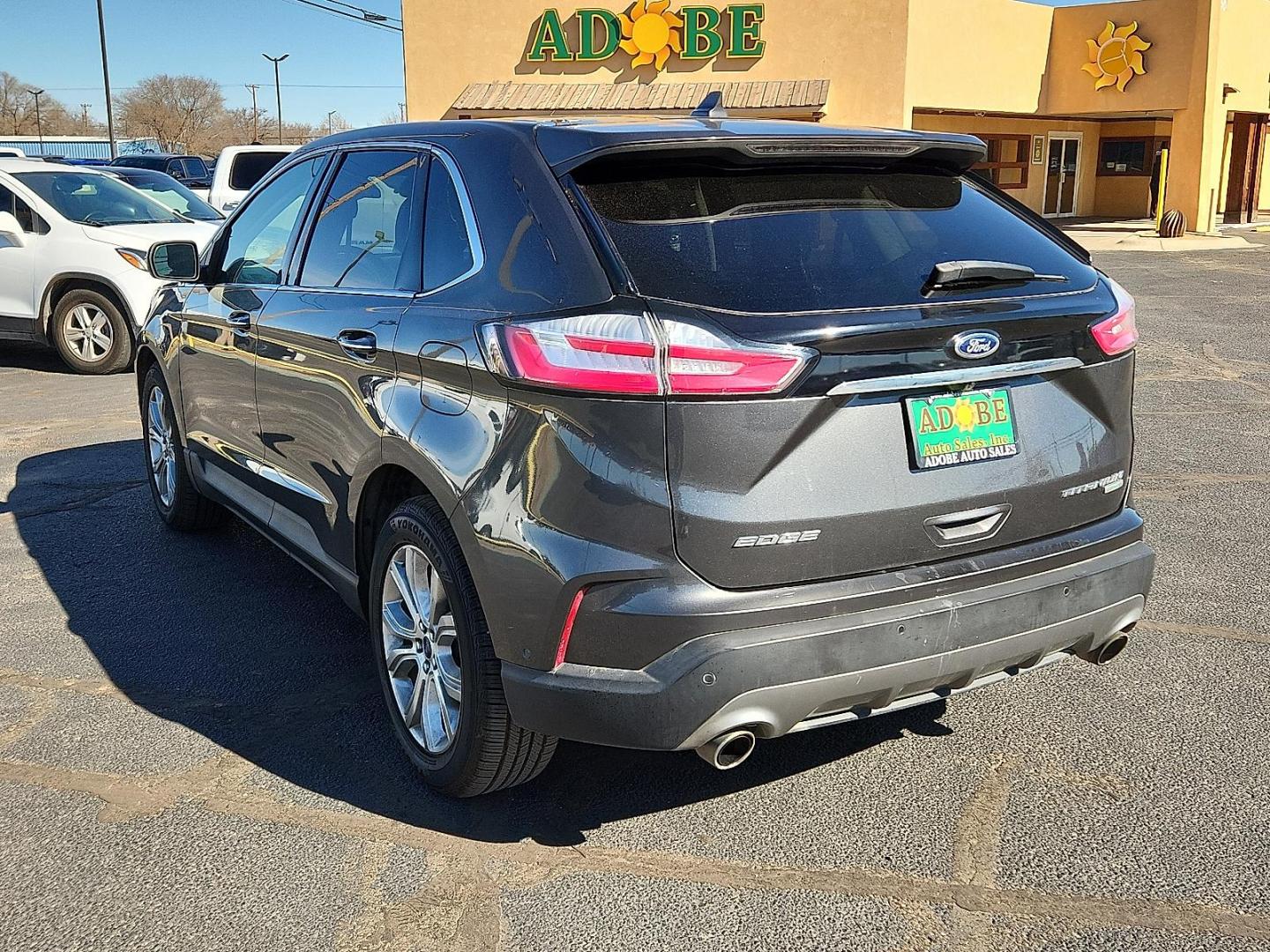 2019 GRAY Ford Edge Titanium (2FMPK3K91KB) with an EcoBoost 2L I-4 gasoline direct injection, DOHC, variable valve control, intercooled turbo, premium unleaded, engine with 250HP engine, located at 4711 Ave Q, Lubbock, TX, 79412, (806) 687-2362, 33.551304, -101.855293 - Photo#2