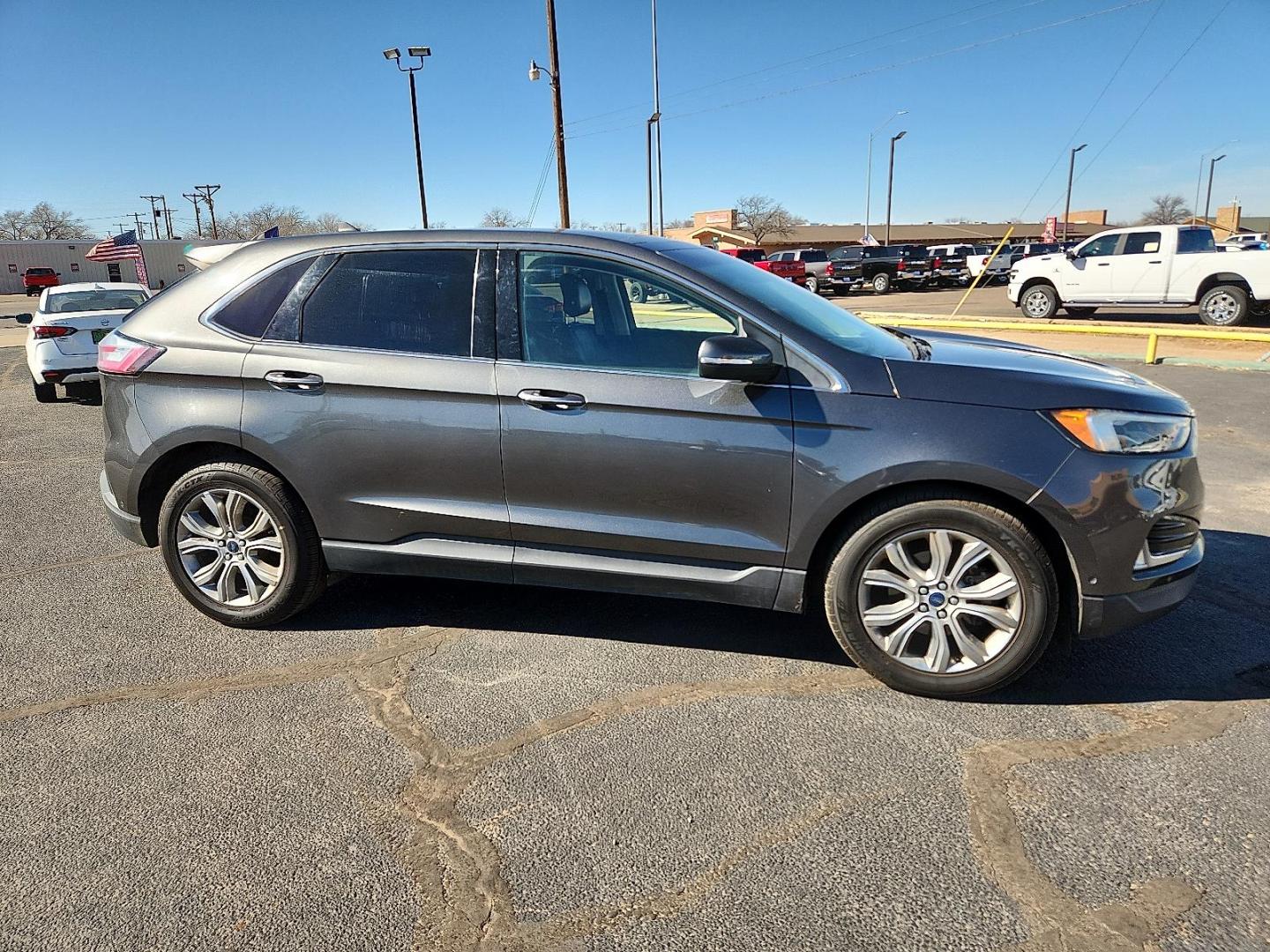 2019 GRAY Ford Edge Titanium (2FMPK3K91KB) with an EcoBoost 2L I-4 gasoline direct injection, DOHC, variable valve control, intercooled turbo, premium unleaded, engine with 250HP engine, located at 4711 Ave Q, Lubbock, TX, 79412, (806) 687-2362, 33.551304, -101.855293 - Photo#4