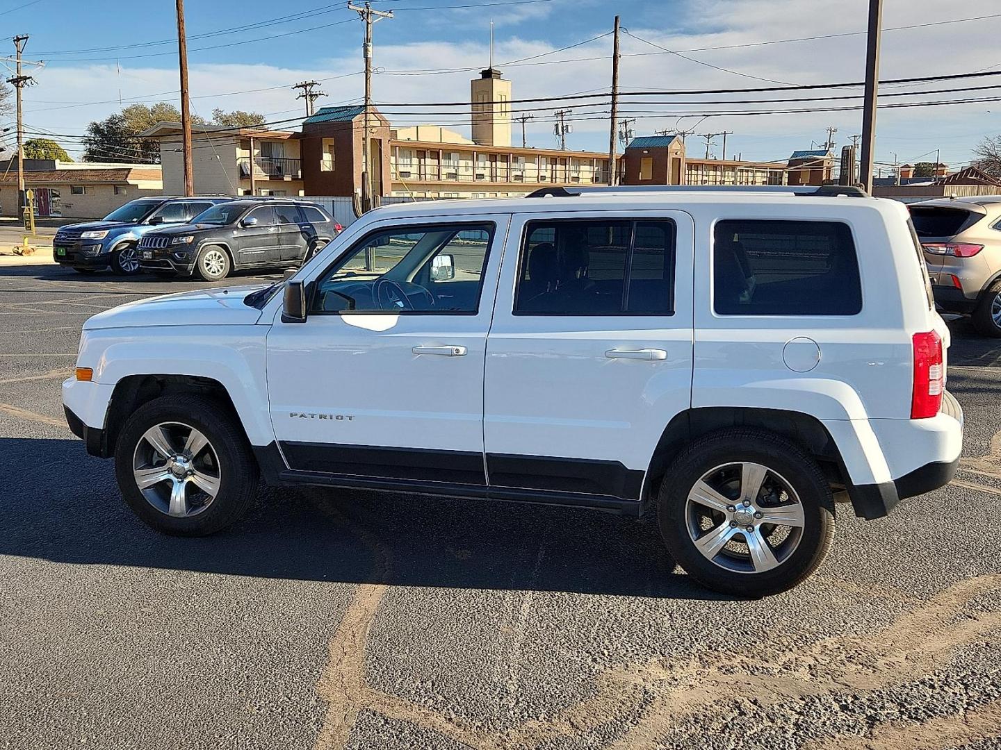 2017 WHITE Jeep Patriot High Altitude 4x4 (1C4NJRFB6HD) with an 2.4L I-4 DOHC, variable valve control, regular unleaded, engine with 172HP engine, located at 4711 Ave Q, Lubbock, TX, 79412, (806) 687-2362, 33.551304, -101.855293 - Photo#1