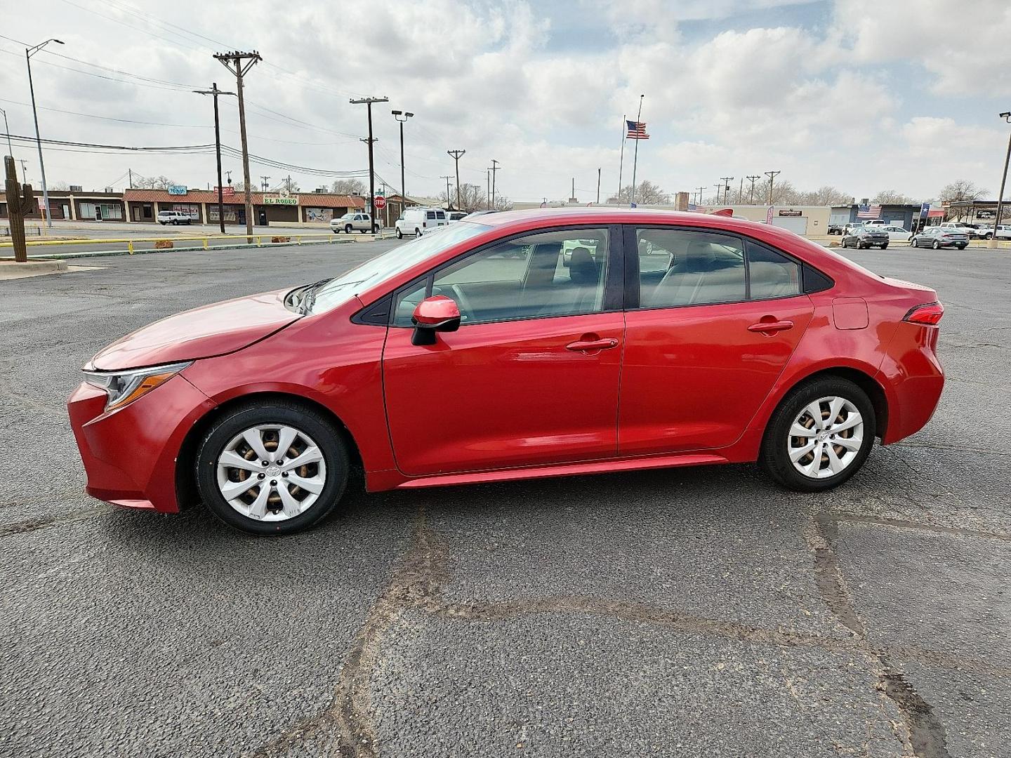 2021 RED /Grey Toyota Corolla LE (JTDEPMAE8MJ) with an 1.8L I-4 DOHC, VVT-i variable valve control, regular unleaded, engine with 139HP engine, located at 4711 Ave Q, Lubbock, TX, 79412, (806) 687-2362, 33.551304, -101.855293 - Photo#1
