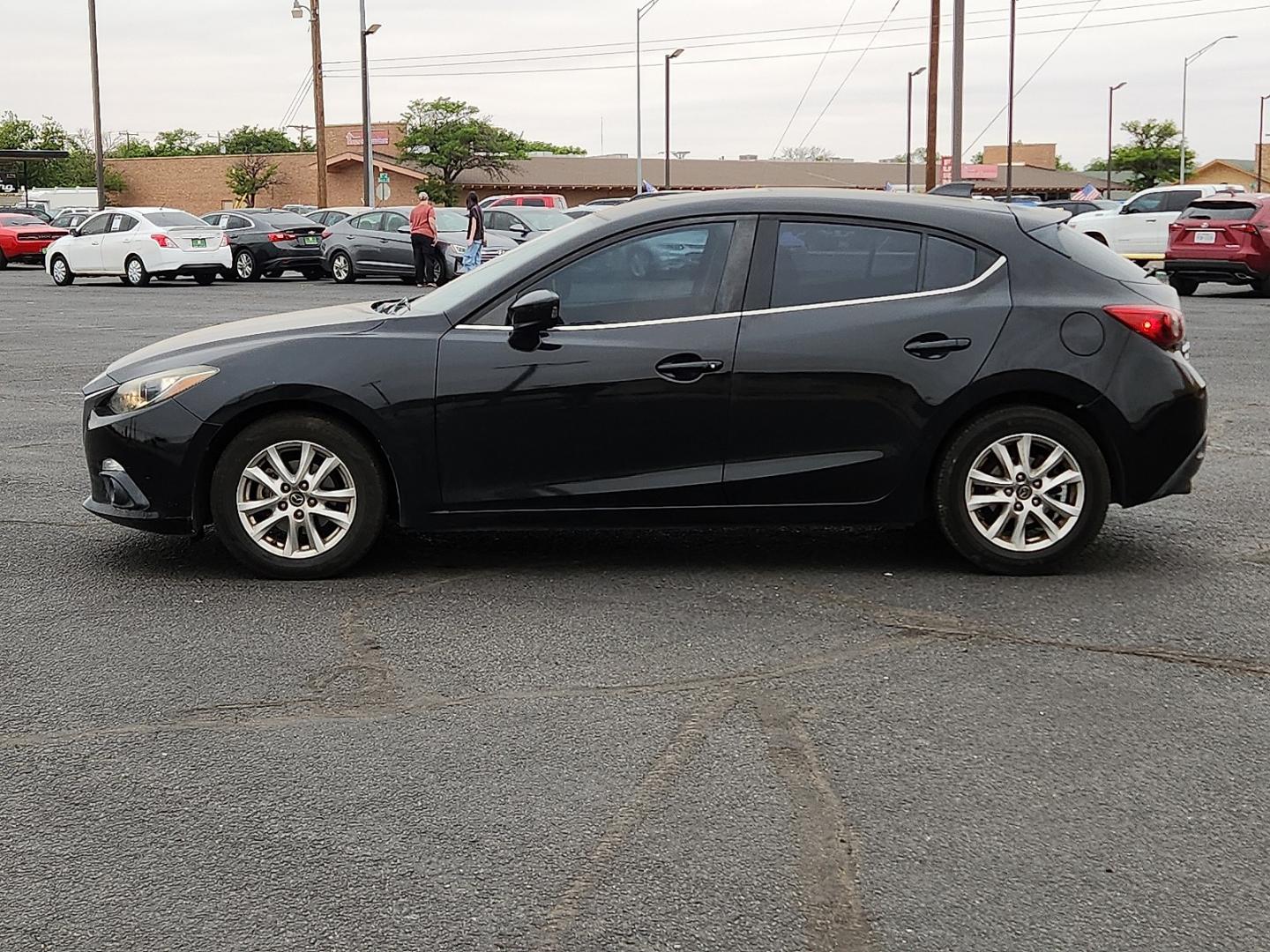 2016 BLACK /Black - BV0 Mazda Mazda3 Hatchback i Grand Touring (3MZBM1N77GM) with an SKYACTIV-G 2L I-4 gasoline direct injection, DOHC, variable valve control, regular unleaded, engine with 155HP engine, located at 4711 Ave Q, Lubbock, TX, 79412, (806) 687-2362, 33.551304, -101.855293 - Photo#1