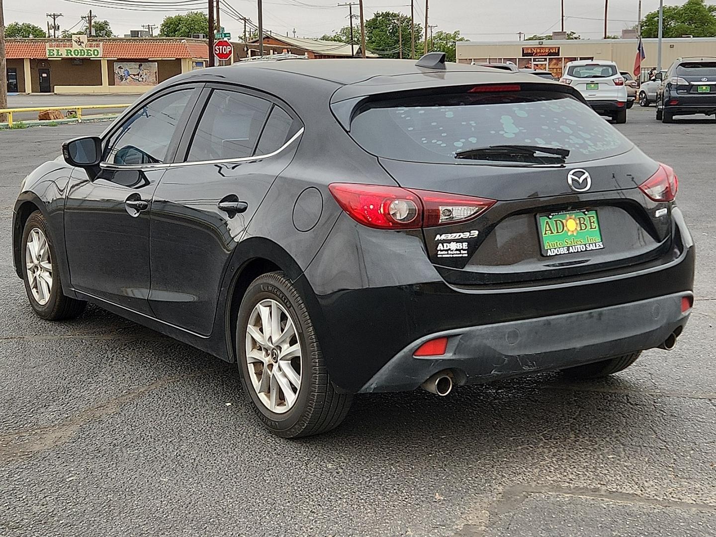 2016 BLACK /Black - BV0 Mazda Mazda3 Hatchback i Grand Touring (3MZBM1N77GM) with an SKYACTIV-G 2L I-4 gasoline direct injection, DOHC, variable valve control, regular unleaded, engine with 155HP engine, located at 4711 Ave Q, Lubbock, TX, 79412, (806) 687-2362, 33.551304, -101.855293 - Photo#2