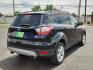2018 BLACK /Medium Light Stone - KL Ford Escape SE (1FMCU0G9XJU) with an EcoBoost 2L I-4 gasoline direct injection, DOHC, variable valve control, intercooled turbo, premium unleaded, engine with 245HP engine, located at 4711 Ave Q, Lubbock, TX, 79412, (806) 687-2362, 33.551304, -101.855293- Photo#3