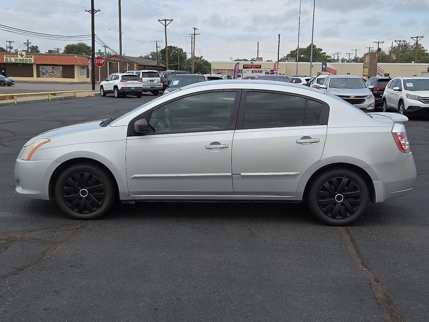 2012 Brilliant Silver - K23 /Gray Nissan Sentra 2.0 S (3N1AB6AP9CL) with an 2L I-4 DOHC, variable valve control, regular unleaded, engine with 140HP engine, located at 4711 Ave Q, Lubbock, TX, 79412, (806) 687-2362, 33.551304, -101.855293- Photo#1