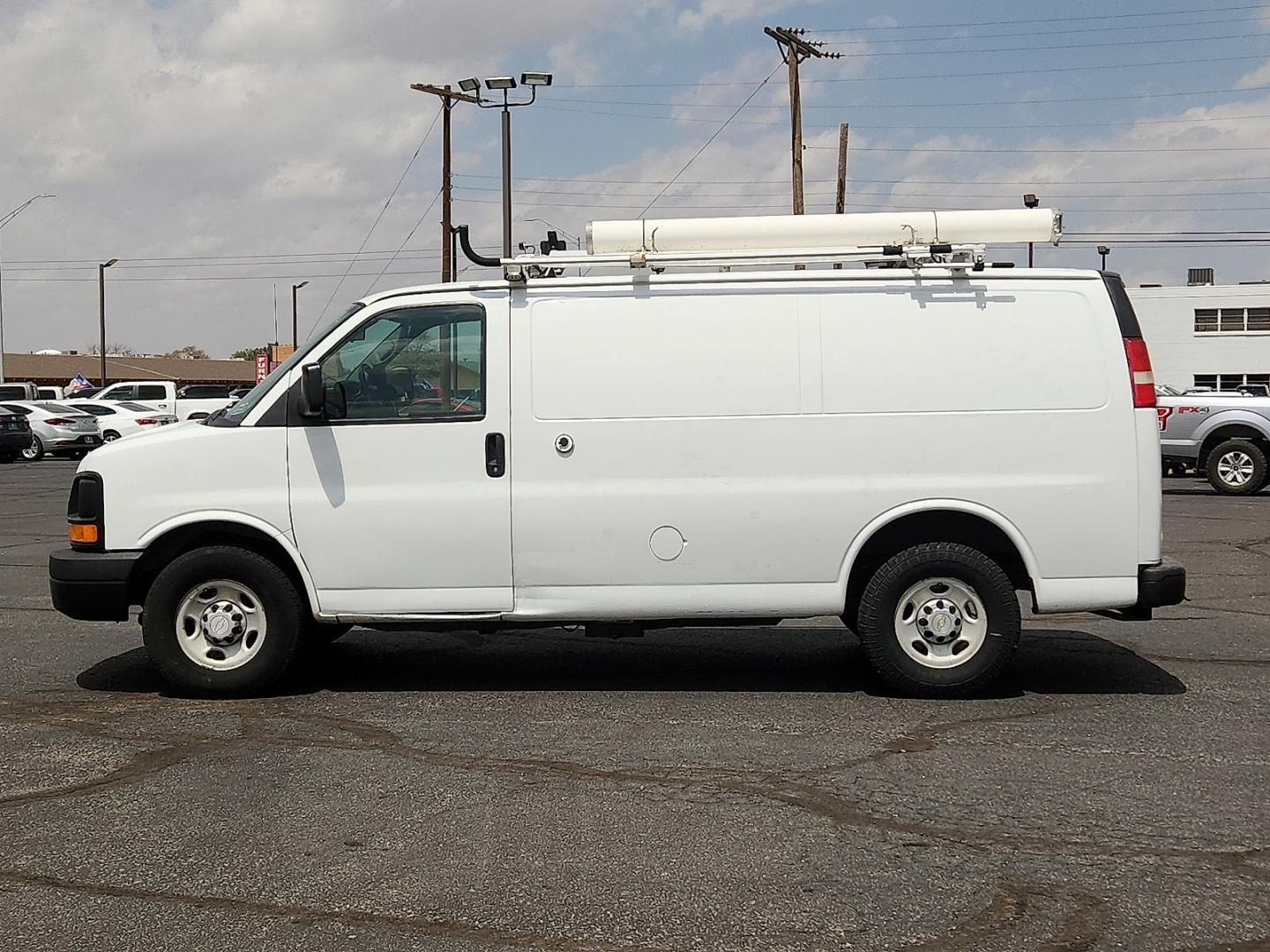 2013 WHITE /Medium Pewter - 93W Chevrolet Express 2500 Work Van (1GCWGFCA0D1) with an Vortec 4.8L V-8 variable valve control, regular unleaded, engine with 280HP engine, located at 4711 Ave Q, Lubbock, TX, 79412, (806) 687-2362, 33.551304, -101.855293- Photo#1