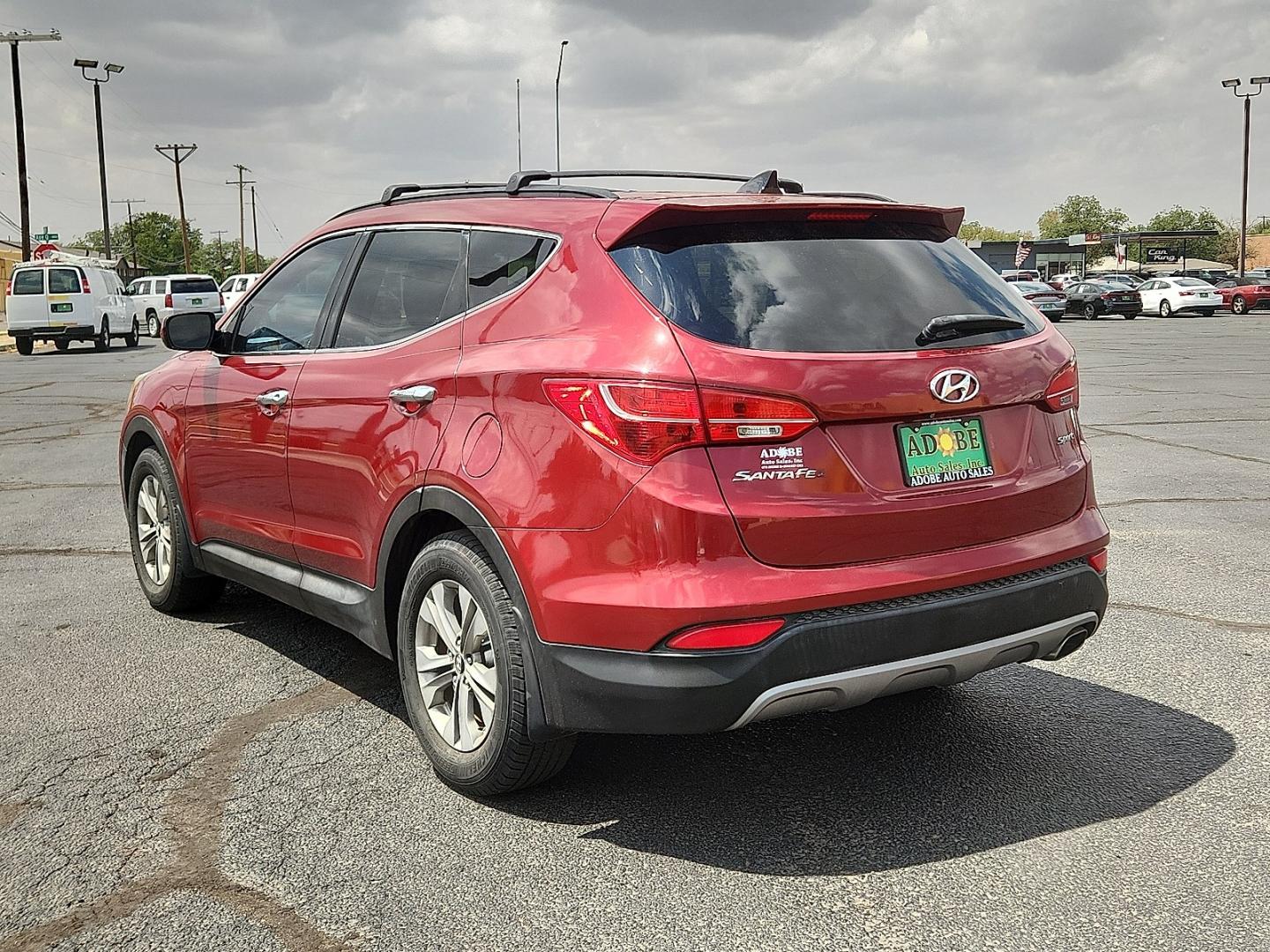 2014 RED Hyundai Santa Fe Sport 2.4L (5XYZU3LB9EG) with an Theta II 2.4L I-4 gasoline direct injection, DOHC, variable valve control, regular unleaded, engine with 190HP engine, located at 4711 Ave Q, Lubbock, TX, 79412, (806) 687-2362, 33.551304, -101.855293- Photo#2