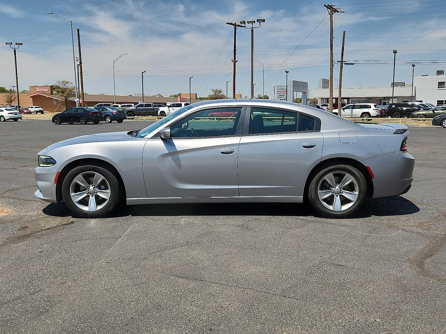 2015 SILVER /Black - X9 Dodge Charger SE (2C3CDXBG2FH) with an 3.6L V-6 DOHC, variable valve control, regular unleaded, engine with 292HP engine, located at 4711 Ave Q, Lubbock, TX, 79412, (806) 687-2362, 33.551304, -101.855293- Photo#1