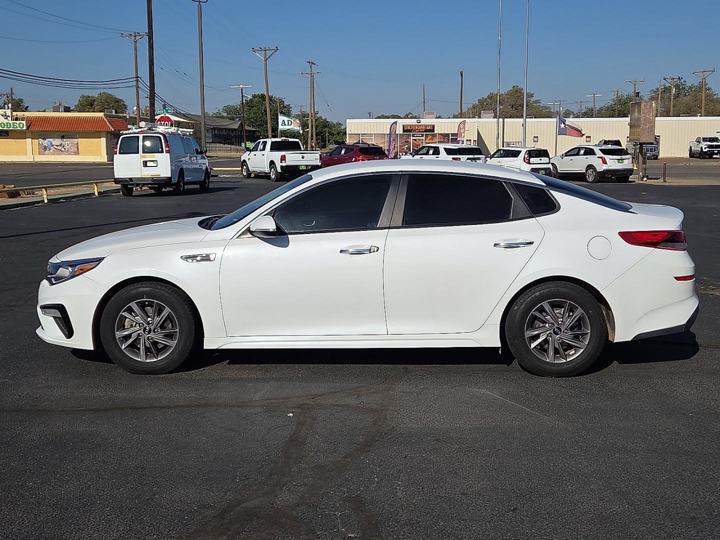 2020 Snow White Pearl - SWP /Black - WK Kia Optima LX (5XXGT4L33LG) with an Theta II 2.4L I-4 gasoline direct injection, DOHC, D-CVVT variable valve control, regular unleaded, engine with 185HP engine, located at 4711 Ave Q, Lubbock, TX, 79412, (806) 687-2362, 33.551304, -101.855293- Photo#1