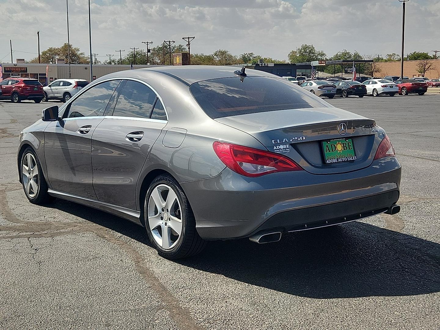 2016 GRAY Mercedes-Benz CLA 250 4MATIC (WDDSJ4GB6GN) with an 2L I-4 direct injection, DOHC, variable valve control, intercooled turbo, premium gasoline, engine with 208HP engine, located at 4711 Ave Q, Lubbock, TX, 79412, (806) 687-2362, 33.551304, -101.855293- Photo#2