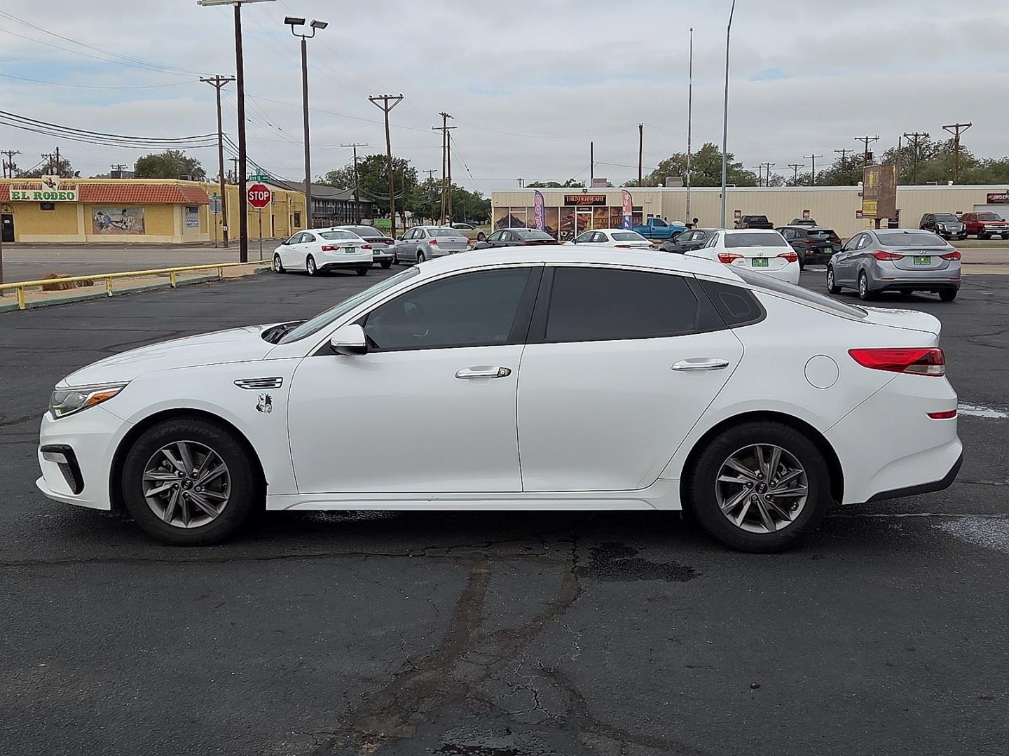 2020 Snow White Pearl - SWP /Black - WK Kia Optima LX (5XXGT4L31LG) with an Theta II 2.4L I-4 direct injection, DOHC, D-CVVT variable valve control, regular gasoline, engine with 185HP engine, located at 4711 Ave Q, Lubbock, TX, 79412, (806) 687-2362, 33.551304, -101.855293- Photo#1
