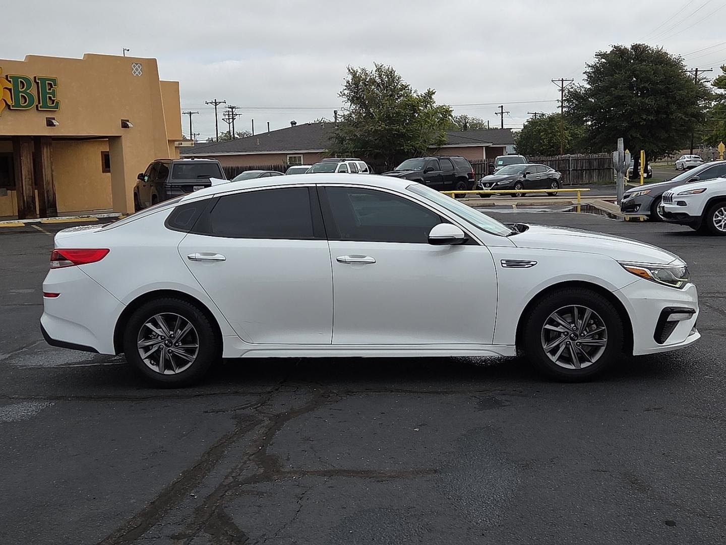 2020 Snow White Pearl - SWP /Black - WK Kia Optima LX (5XXGT4L31LG) with an Theta II 2.4L I-4 direct injection, DOHC, D-CVVT variable valve control, regular gasoline, engine with 185HP engine, located at 4711 Ave Q, Lubbock, TX, 79412, (806) 687-2362, 33.551304, -101.855293- Photo#5